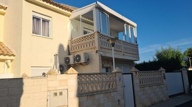 Foto 2 de Casa adosada en venta en Rincón de Loix de 4 habitaciones con piscina y garaje