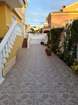 Foto 2 de Venta de casa adosada en El Perelló - Les Palmeres - Mareny de Barraquetes de 3 habitaciones con terraza y piscina