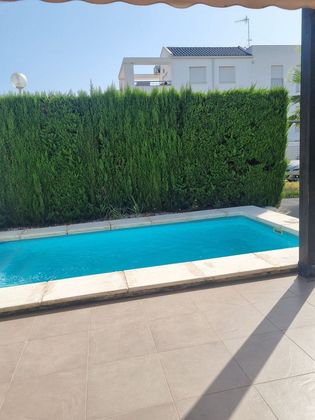 Foto 2 de Venta de casa adosada en Oliva Nova de 2 habitaciones con terraza y piscina