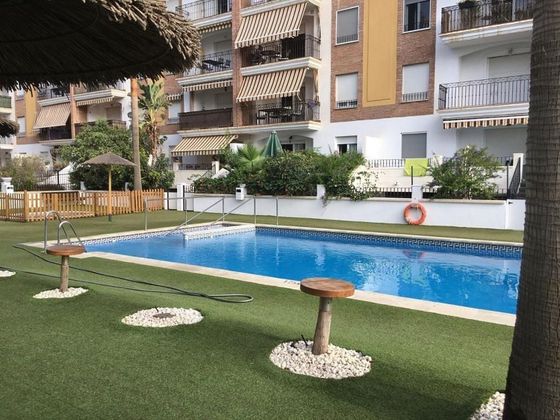 Foto 1 de Piso en venta en Playa de Granada de 3 habitaciones con terraza y piscina