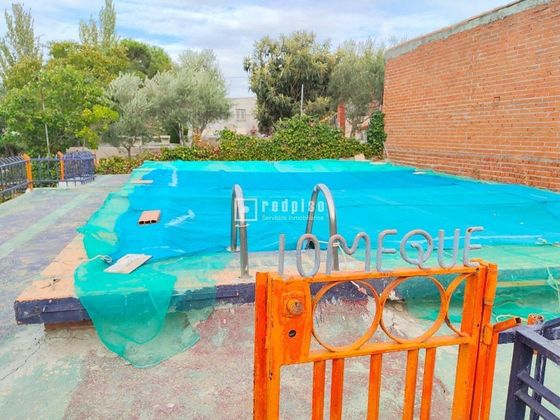 Foto 1 de Casa en venda a Palomeque de 3 habitacions amb piscina i garatge