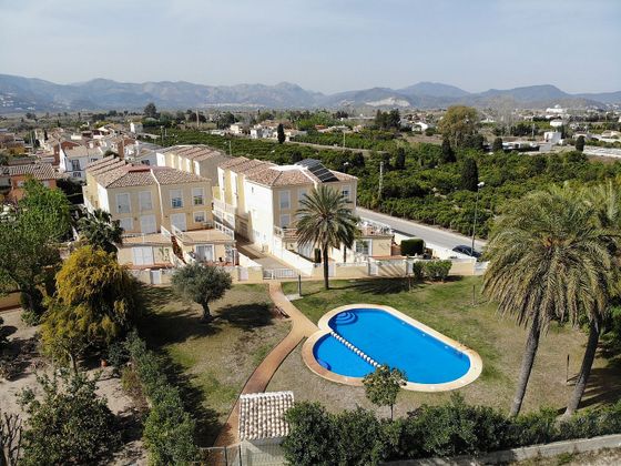 Foto 2 de Venta de casa adosada en Oliva Nova de 2 habitaciones con terraza y piscina