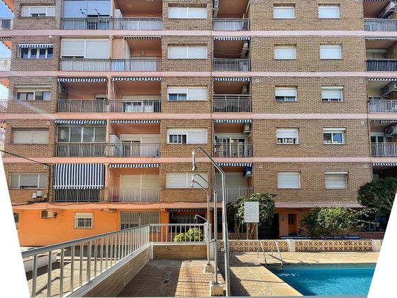 Foto 2 de Piso en venta en calle La Pobla de Farnals de 3 habitaciones con terraza y piscina