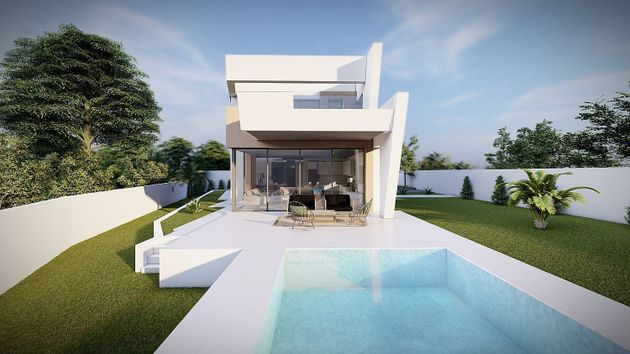 Foto 1 de Casa nova en venda a urbanización Carrió Park de 4 habitacions amb piscina i jardí