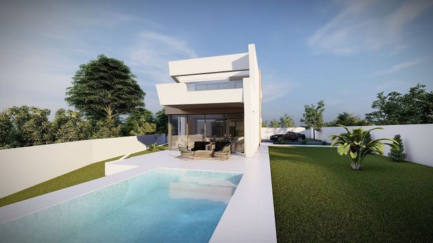 Foto 2 de Casa nova en venda a urbanización Carrió Park de 4 habitacions amb piscina i jardí