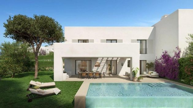 Foto 1 de Casa nova en venda a urbanización La Reserva de 3 habitacions amb piscina i jardí