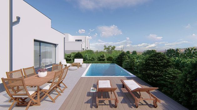 Foto 2 de Casa nova en venda a calle Severo Ochoa de 4 habitacions amb jardí i aire acondicionat