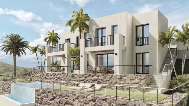 Foto 1 de Casa nova en venda a urbanización Camarate Golf de 3 habitacions amb piscina i jardí