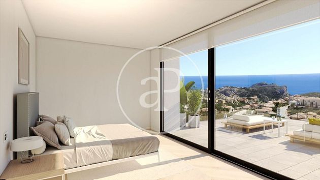 Foto 2 de Casa nova en venda a urbanización Cumbre del Sol Benitachell de 4 habitacions amb piscina i jardí