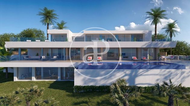 Foto 2 de Casa nova en venda a urbanización Cumbre del Sol Benitachell de 6 habitacions amb piscina i jardí