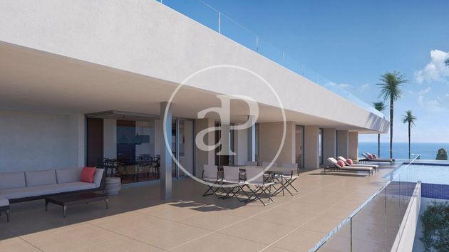 Foto 1 de Casa nova en venda a urbanización Cumbre del Sol Benitachell de 6 habitacions amb piscina i jardí