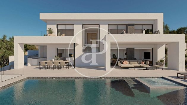 Foto 2 de Casa nova en venda a urbanización Cumbre del Sol Benitachell de 3 habitacions amb piscina i jardí