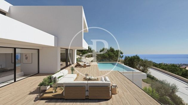 Foto 2 de Venta de casa nueva en urbanización Cumbre del Sol Benitachell de 3 habitaciones con piscina y jardín