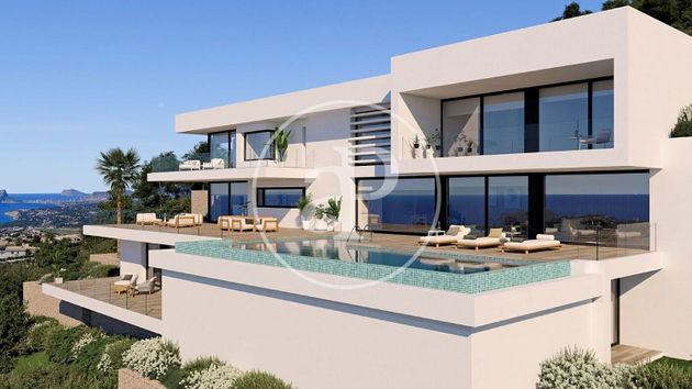 Foto 1 de Venta de casa nueva en urbanización Cumbre del Sol Benitachell de 5 habitaciones con piscina y jardín