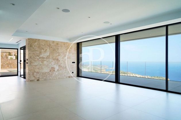 Foto 2 de Casa nova en venda a urbanización Cumbre del Sol Benitachell de 5 habitacions amb piscina i jardí