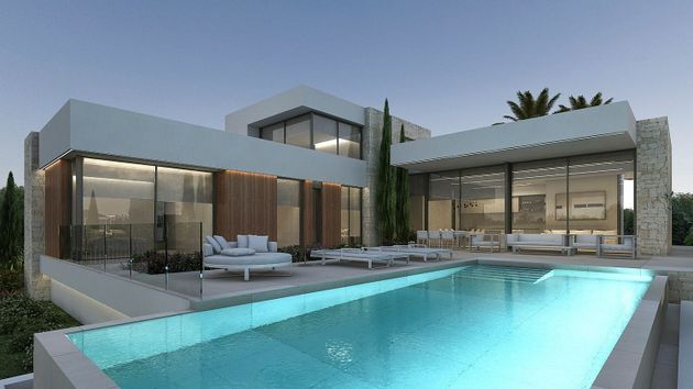 Foto 2 de Venta de casa nueva en Moravit - Cap Blanc de 4 habitaciones con piscina y jardín