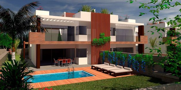 Foto 1 de Casa nova en venda a calle Villas Do Xarío de 4 habitacions amb jardí