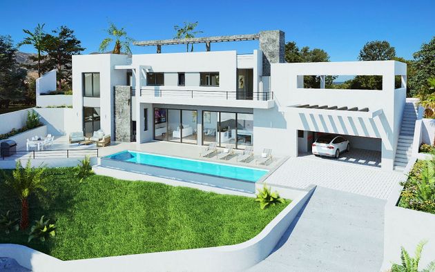 Foto 2 de Casa nova en venda a calle Geranios de 4 habitacions amb piscina i jardí
