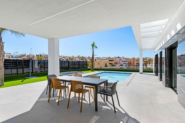 Foto 1 de Casa nova en venda a Algorfa de 3 habitacions amb piscina i jardí