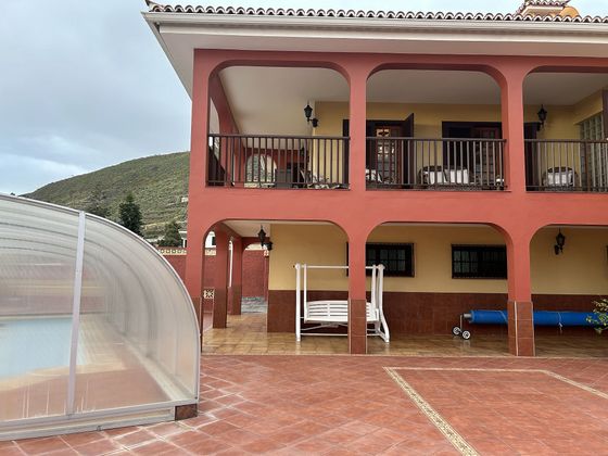 Foto 1 de Venta de chalet en urbanización El Drago de 4 habitaciones con terraza y piscina