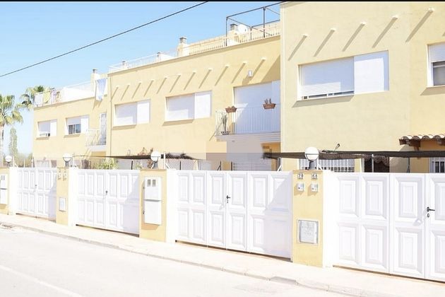 Foto 1 de Venta de casa adosada en calle Camí Ben Afelí de 3 habitaciones con terraza y piscina